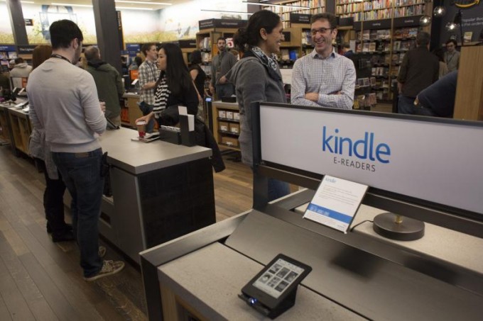 Customers shop at Amazon Books in Seattle, Washington, on Tuesday, Nov. 3, 2015. The online retailer Amazon.com Inc. opened its first brick-and-mortar location in Seattle's upscale University Village mall. Photographer: David Ryder/Bloomberg